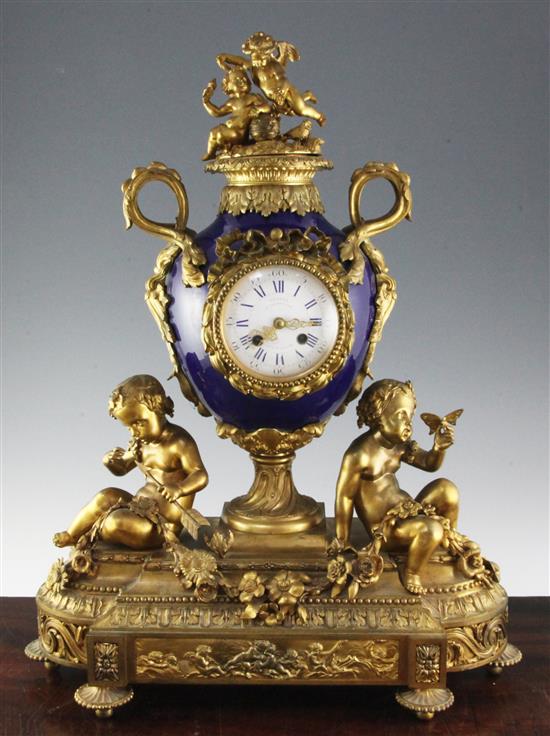A late 19th century French ormolu and bleu de roi porcelain mantel clock, 23in.